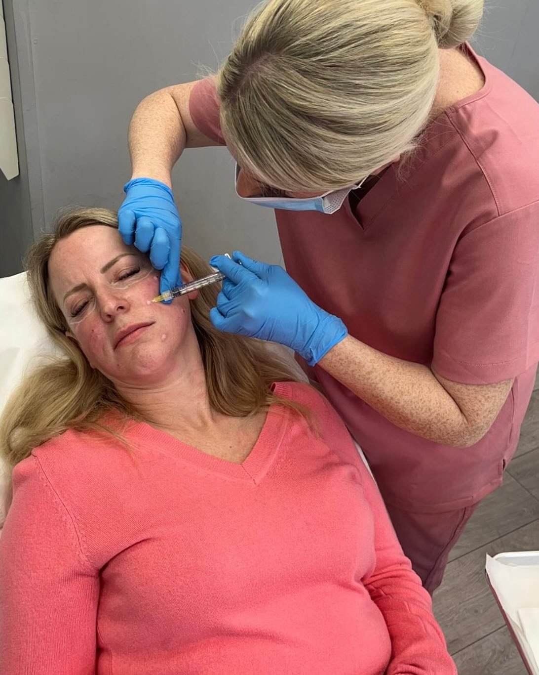 Registered nurse delivering aesthetic care in a clinical setting
